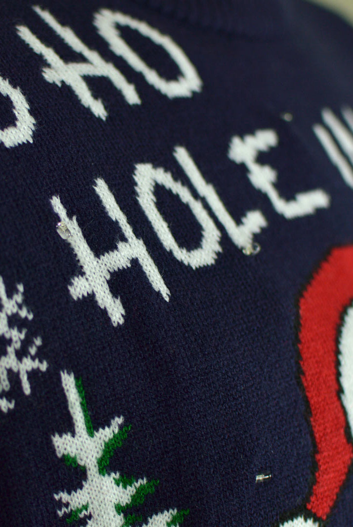 details LED light-up Men's Christmas Jumper with Santa playing Golf