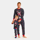 Christmas Pyjama Family and Children with Skiing Santa
